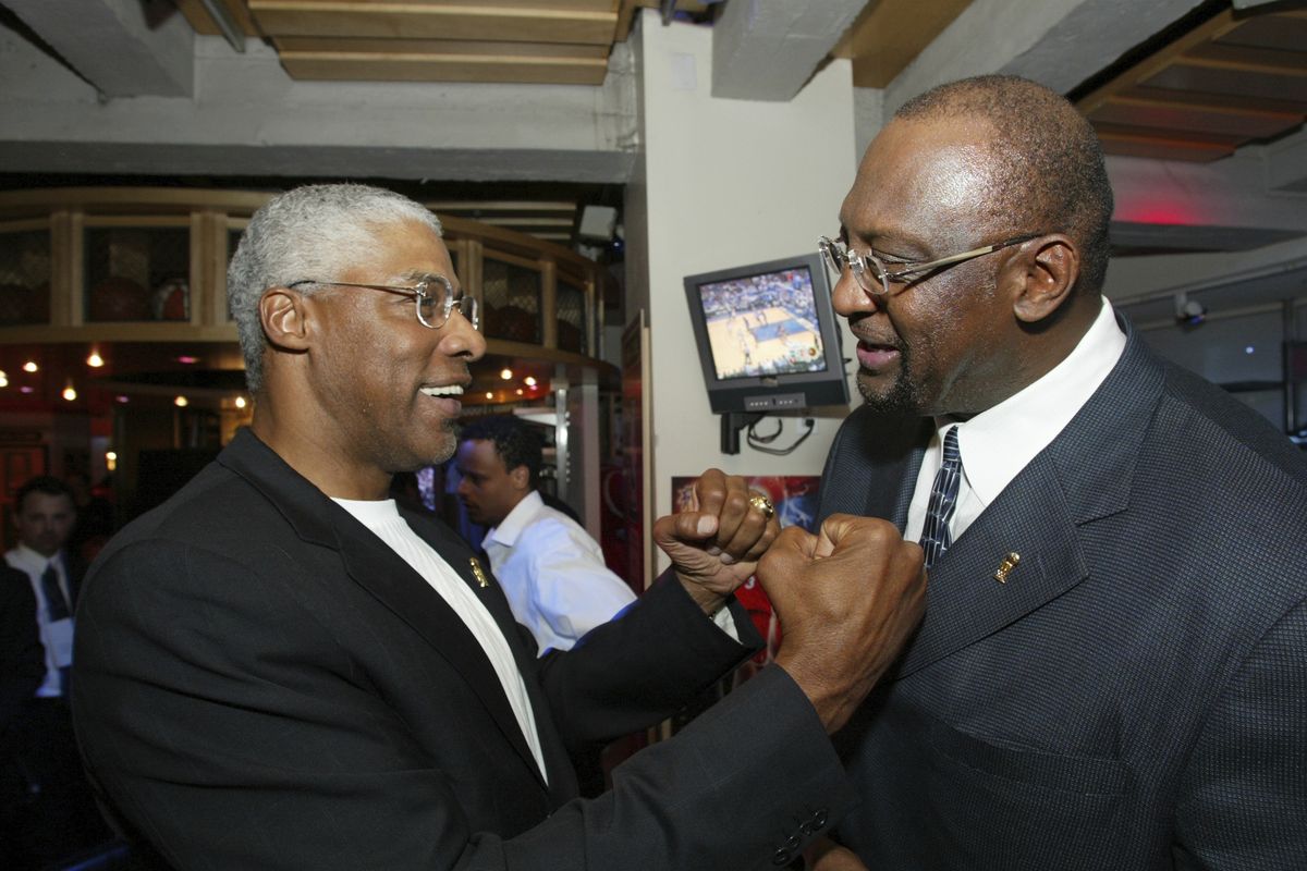 NBA legend Julius "Dr. J" Erving, left, greets former Milwaukee Bucks