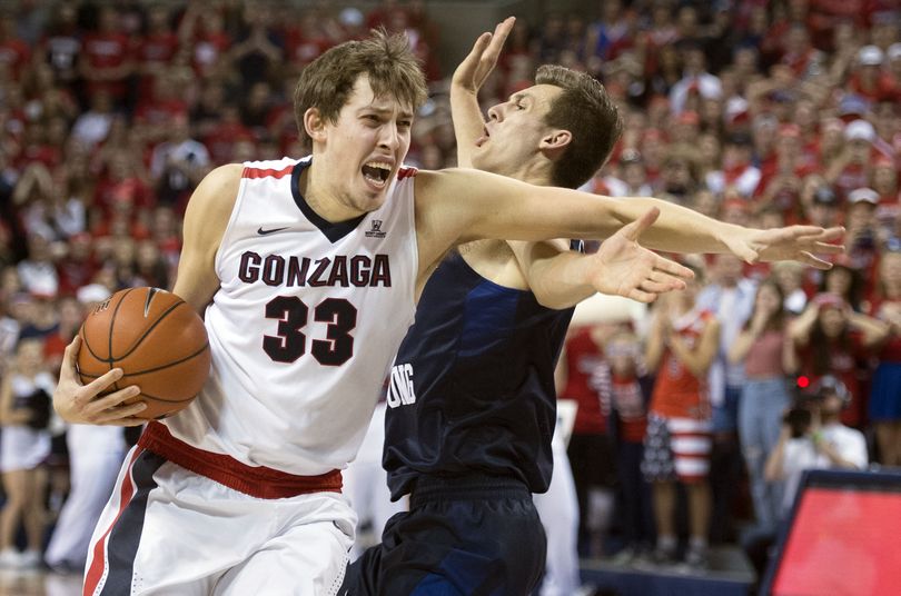 Gonzaga forward Kyle Wiltjer (33) is fouled during the last few seconds of the game by BYU guard Kyle Collinsworth, Thursday, Jan. 14, 2016 in Spokane. (Colin Mulvany / The Spokesman-Review)