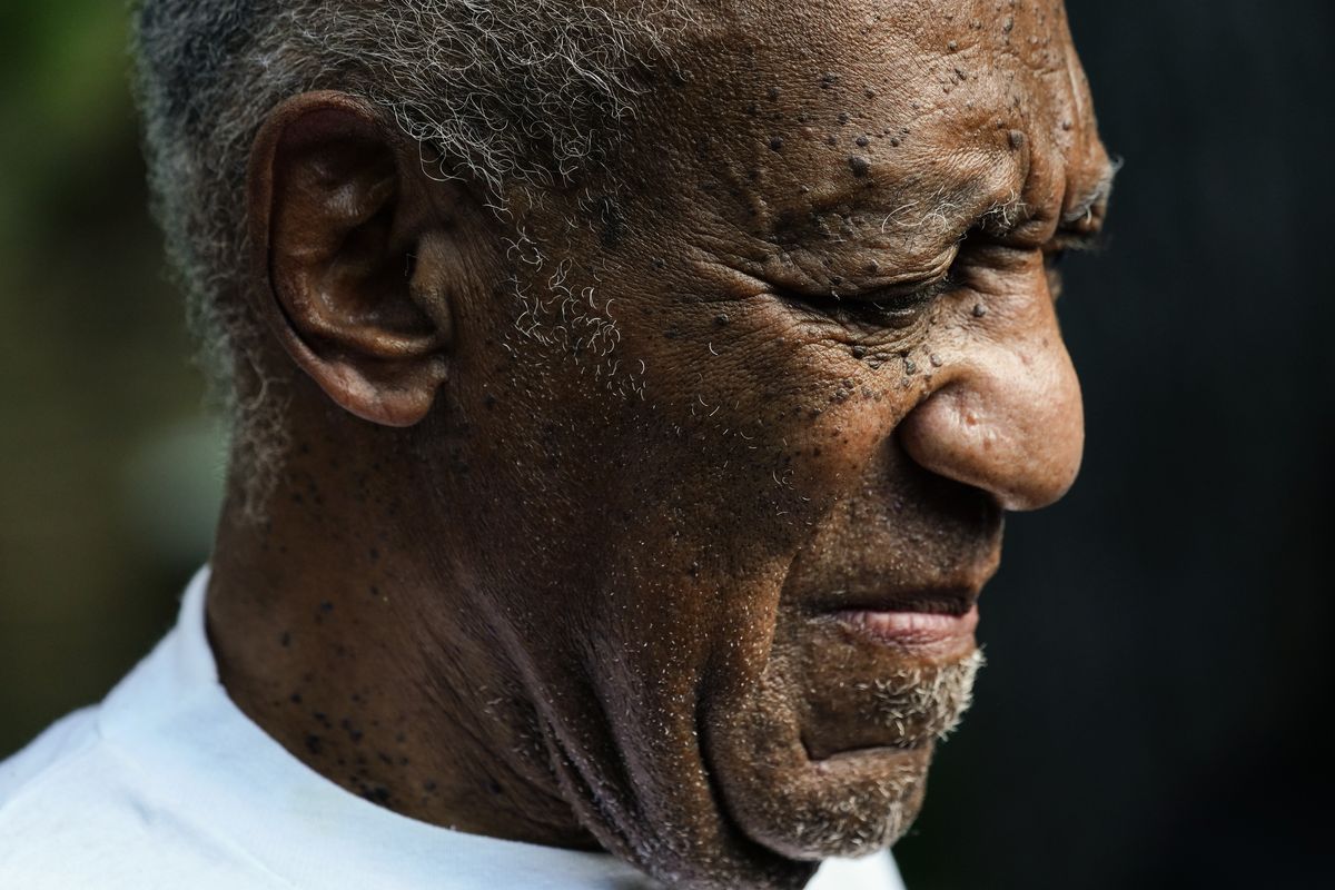 Bill Cosby listens to members of his team speak during a news conference outside his home in Elkins Park, Pa., Wednesday, June 30, 2021, after being released from prison. Pennsylvania's highest court has overturned comedian Cosby's sex assault conviction. The court said Wednesday, that they found an agreement with a previous prosecutor prevented him from being charged in the case. The 83-year-old Cosby had served more than two years at the state prison near Philadelphia and was released.  (Matt Rourke)