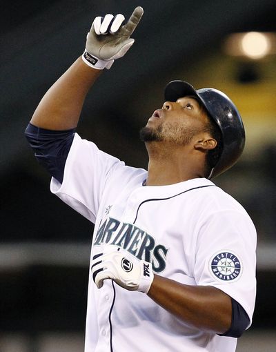 Carlos Peguero stands on second and points skyward after hitting an RBI-double in the sixth inning. (Associated Press)