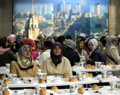 
Turkish women wait to break their fast in Istanbul, Turkey,  Wednesday on the first day of Ramadan. 
 (Associated Press / The Spokesman-Review)