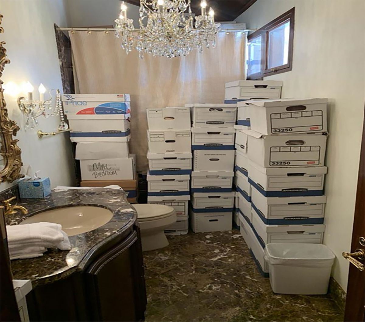 In this handout photo provided by the U.S. Department of Justice, stacks of boxes can be observed in a bathroom and shower in The Mar-a-Lago Club’s Lake Room at former U.S. President Donald Trump’s Mar-a-Lago estate in Palm Beach, Fla.  (Handout)