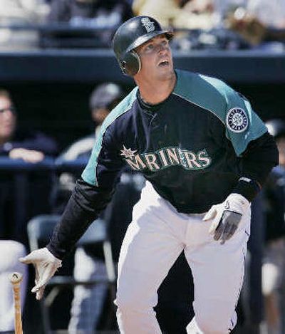 
Seattle's Jeremy Reed watches his home run off Rangers starting pitcher Josh Rupe. 
 (Associated Press / The Spokesman-Review)