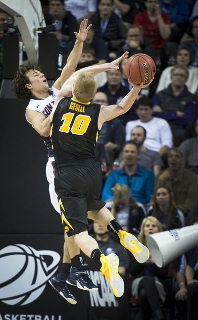 Gonzaga guard Kevin Pangos defends against a shot by Iowa guard Mike Gesell. Pangos scored 10 points in the second half to keep Iowa at bay. (Colin Mulvany)