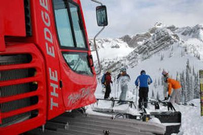 
Powder Cowboy's red Pisten Bully cats are easy to spot against the white backdrop of snow.
 (The Spokesman-Review)