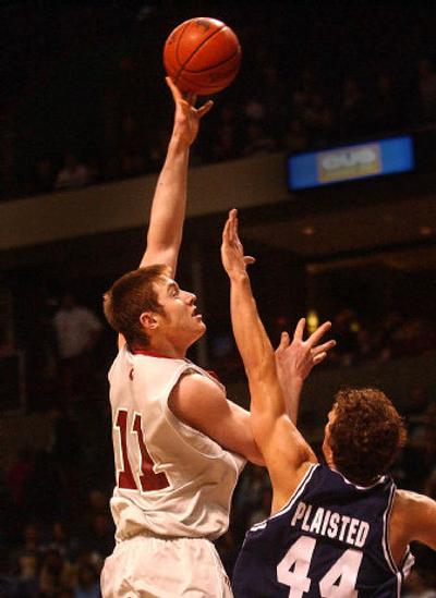 
Aron Baynes shoots over BYU's Trent Plaisted.
 (Brian Plonka / The Spokesman-Review)