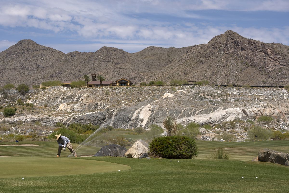 A water sprinkler is adjusted at Victory Course at Verrado, a golf club in Buckeye, Ariz., on April 13, 2023. Officials say there