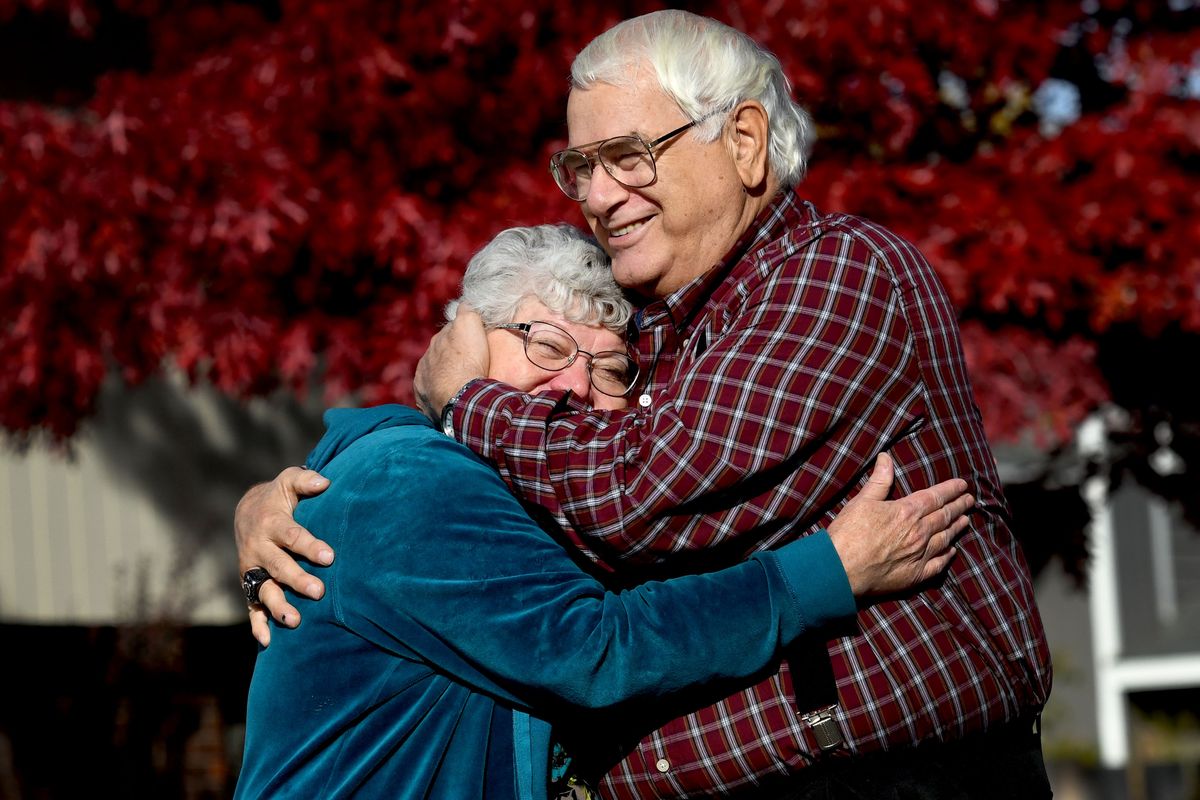 “Meet my girlfriend,” says Dave Sutton as he hugs his wife of 50 years, Vickie, in their front yard in Spokane Valley on Oct. 21.  (Kathy Plonka/The Spokesman-Review)