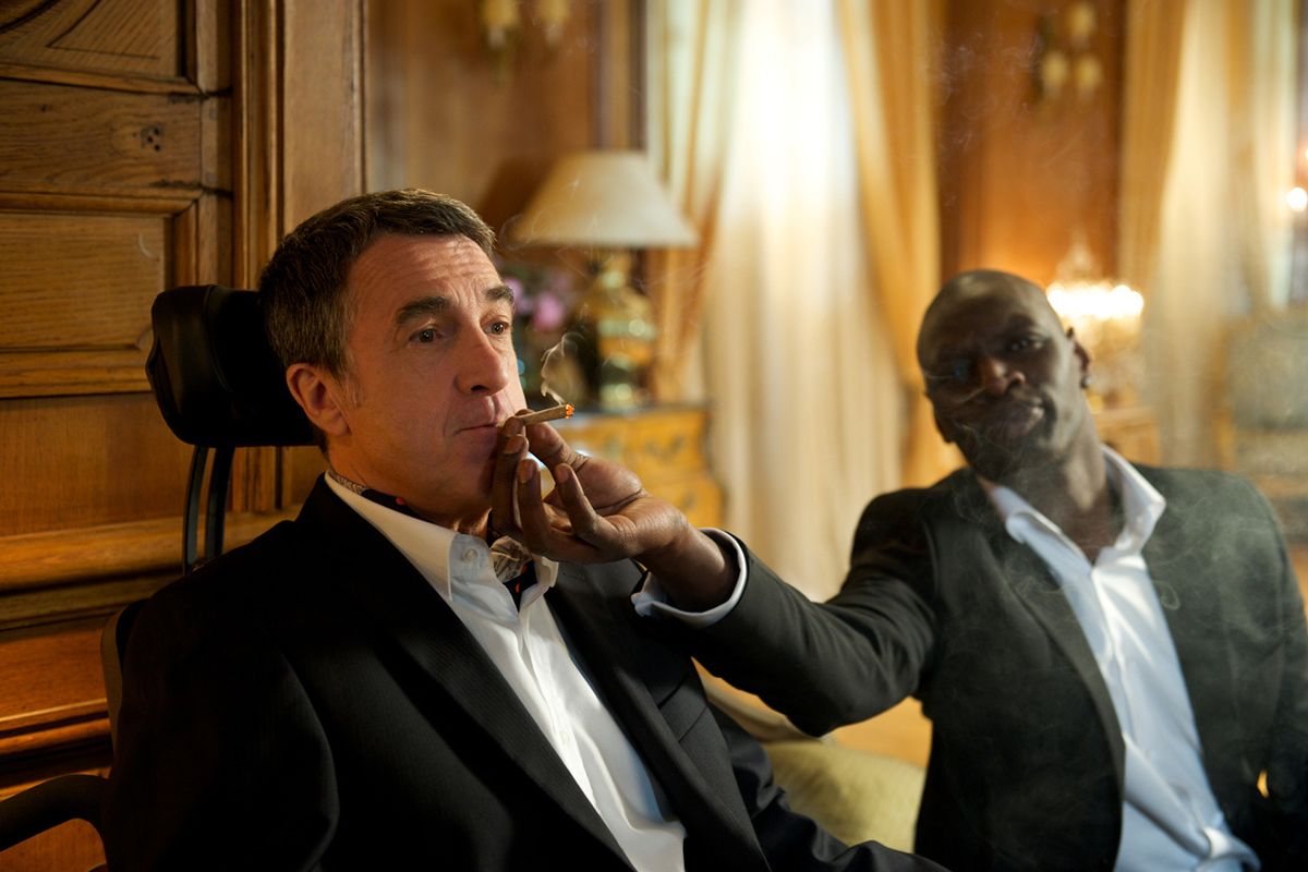 Francois Cluzet, left, and Omar Sy are shown in a scene from “The Intouchables.”