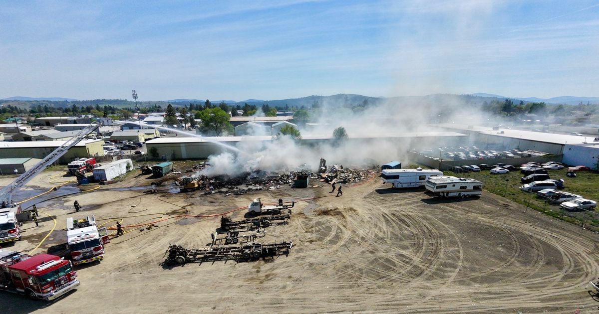 Northeast Spokane RV demolition site ignites, morning smoke visible across Spokane