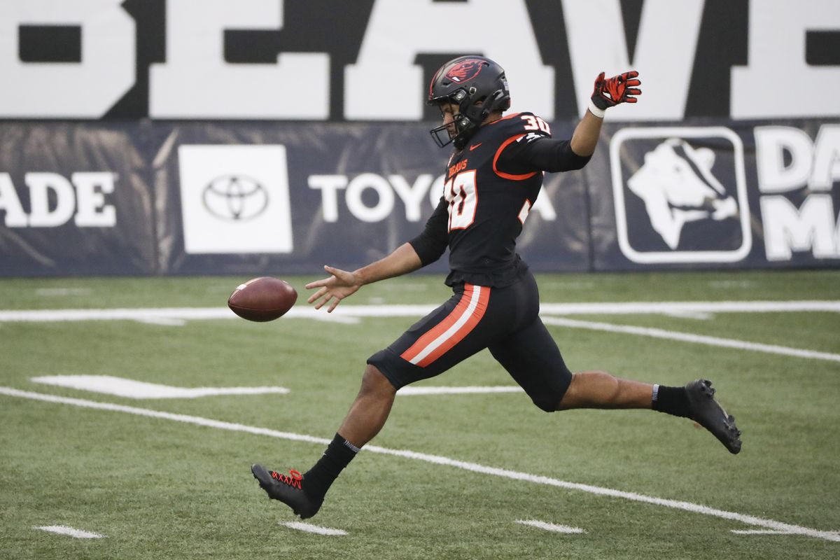 Oregon State’s Caleb Lightbourn punts to California during the second half of a game Nov. 21 in Corvallis, Ore. The Beavers won 31-27.  (Associated Press)