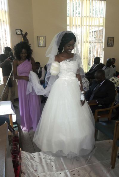 In this photo taken on Saturday, May, 5, 2018, Zanele Ndlovu walks down the aisle on her wedding day at a hospital Chapel in Bulawayo, Zimbabwe. (STR / Associated Press)