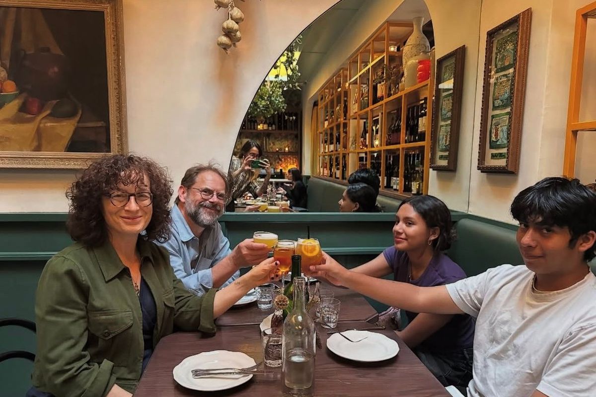 Lerner and Campbell with the two teen siblings they adopted on June 17. (Courtesy of Colin Campbell)