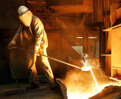 A steel worker takes a sample at the blast furnace of ThyssenKrupp steel company on Sept. 22, 2005 in Duisburg, Germany. Ordering combative action on foreign trade, President Donald Trump has declared that the U.S. will impose steep tariffs on steel and aluminum imports, escalating tensions with China and other trading partners and raising the prospect of higher prices for American consumers and companies. (FRANK AUGSTEIN / Associated Press)