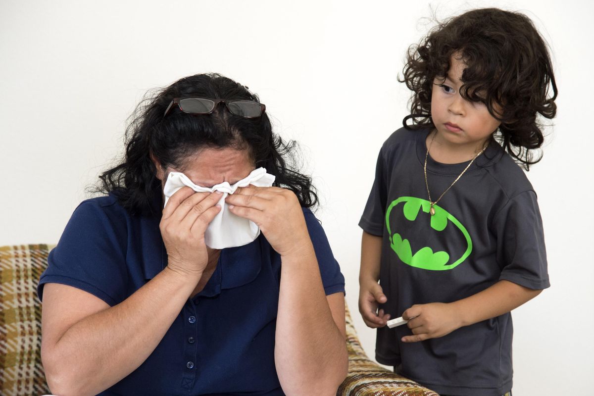 In Moses Lake, Hector, age 3, whose mother was killed by her boyfriend, tries to console his grandmother Nicolasa Garcia Rubio, who was recounting the story of how her daughter died  in March. According to court documents, Hector watched as his father, Manuel Argomaniz Camargo, bludgeoned his mother, Ana Montelongo Garcia, with a hammer and stabbed her with a screwdriver in a gruesome killing along Interstate 90 west of Ritzville. (Colin Mulvany / The Spokesman-Review)