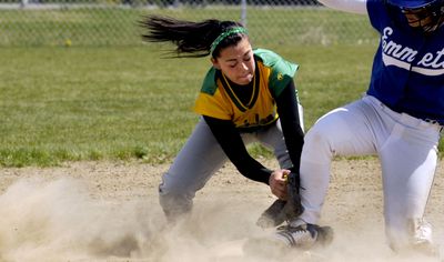 Lakeland’s Alisha Watson doesn’t get the tag down before Alaura Seley of Emmett reaches the base.  (Kathy Plonka / The Spokesman-Review)