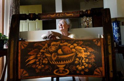 
Marguerite Baldwin is framed through one of a pair of Hitchcock chairs made between 1830 and 1860. 
 (Brian Plonka / The Spokesman-Review)