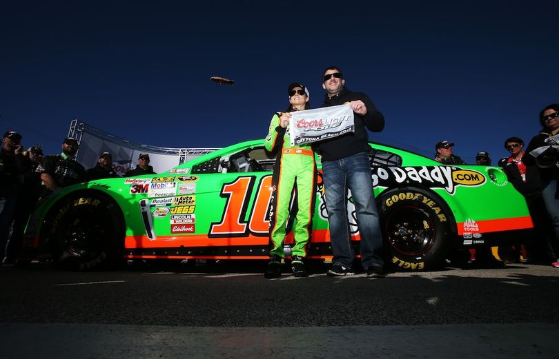 Danica Patrick, driver of the #10 GoDaddy.com Chevrolet, poses with team owner Tony Stewart holding the Coors Light Poll Award after qualifying for the NASCAR Sprint Cup Series Daytona 500 at Daytona International Speedway on February 17, 2013 in Daytona Beach, Florida. (Photo Credit: Jonathan Ferrey/Getty Images for NASCAR) (Jonathan Ferrey / Getty Images North America)