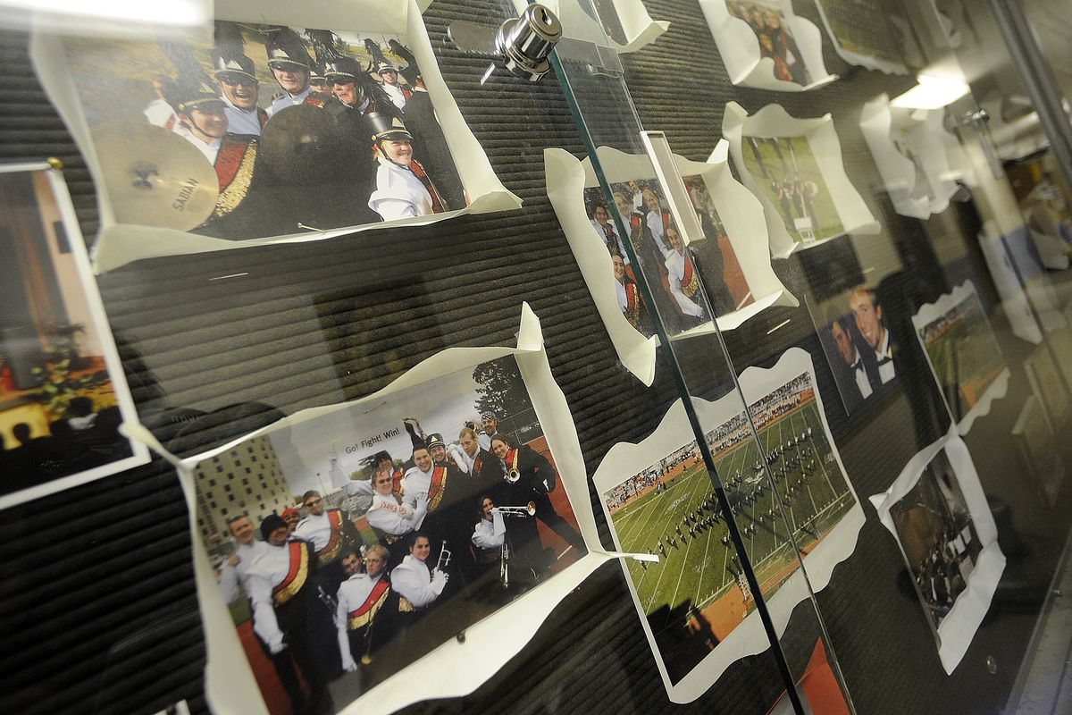 Snapshots of EWU’s marching band adorn the music department bulletin board on the Cheney campus Monday. (CHRISTOPHER ANDERSON / The Spokesman-Review)