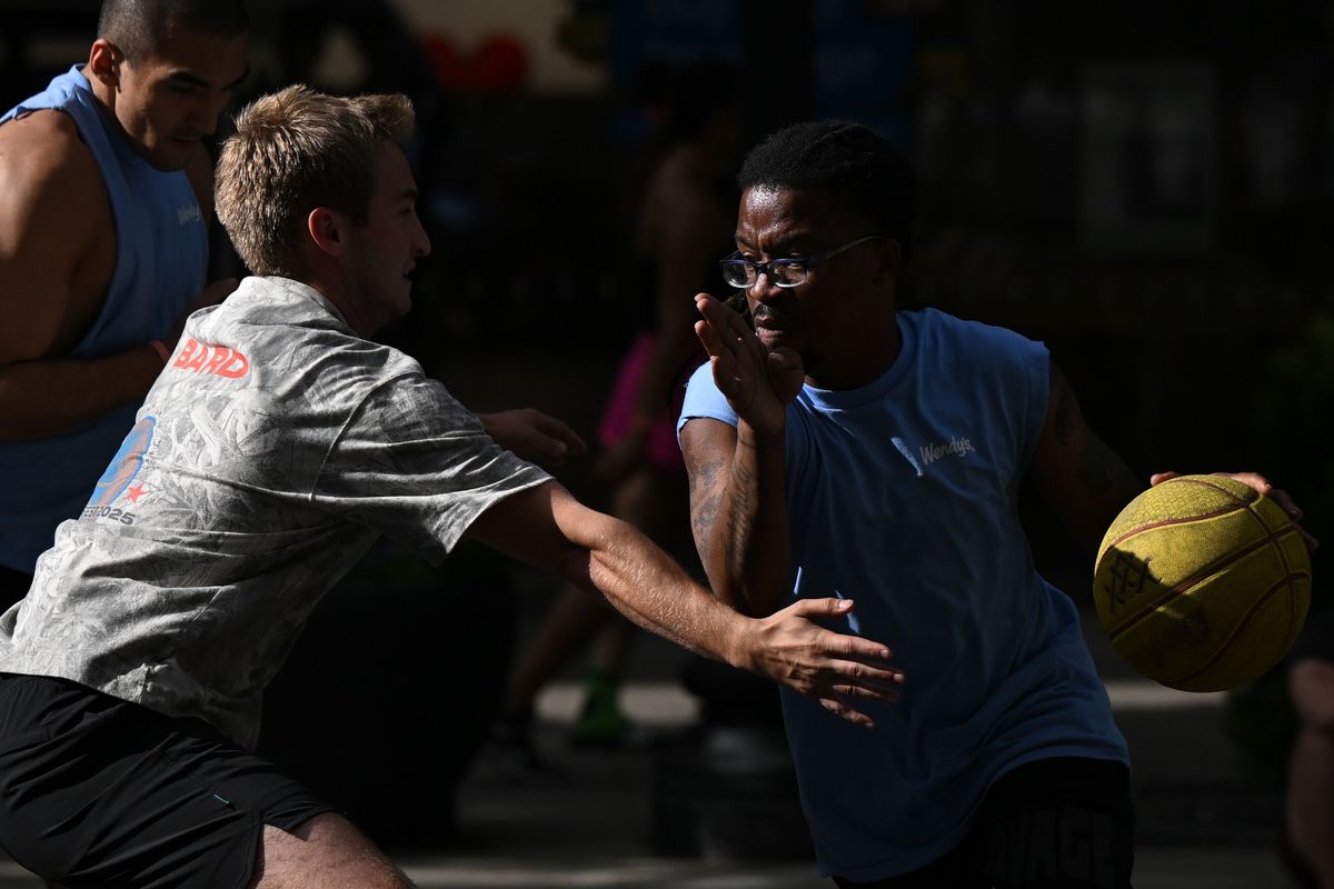 Fresh Never Benched’s LeShawn Palm drives the ball against the Whidbey Wizards during Hoopfest 2025 on Saturday in Spokane. (Tyler Tjomsland/The Spokesman-Review)