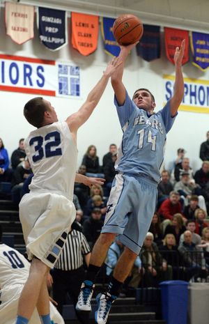 Central Valley's AJ Knudsen, right, spins and launches a floater over Gonzaga Prep's Logan Adams, left, Tuesday, Dec. 10, 2013 at Gonzaga Preparatory School. (Jesse Tinsley / The Spokesman-Review)
