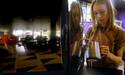 
Nichole Booth, a barista for Black Tie Coffee Co, prepares a coffee drink at the shop in Post Falls. 
 (Kathy Plonka / The Spokesman-Review)