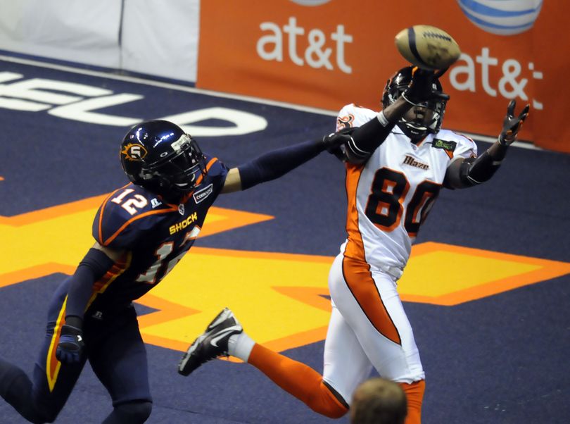 Spokane Shock's Travis Williams, left, can't do anything to stop Utah's Chris Francies from hauling in an early pass for a touchdown Saturday, May 22, 2010 at the Spokane Arena. (Jesse Tinsley / The Spokesman-Review)
