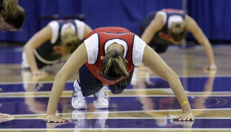 ORG XMIT: WAET113 Gonzaga's Ariam TecleMariam, front, does push-ups with teammates during practice Friday, March 20, 2009, in Seattle in preparation for their first-round women's NCAA college basketball tournament game against Xavier Saturday. (AP Photo/Elaine Thompson) (Elaine Thompson / The Spokesman-Review)