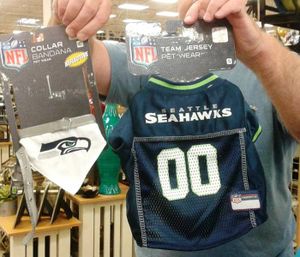 Dunno which of Cindy's male family members is holding these Seattle Seahawks sports garb for pets. But I suspect he didn't have a choice. (Cindy Hval)