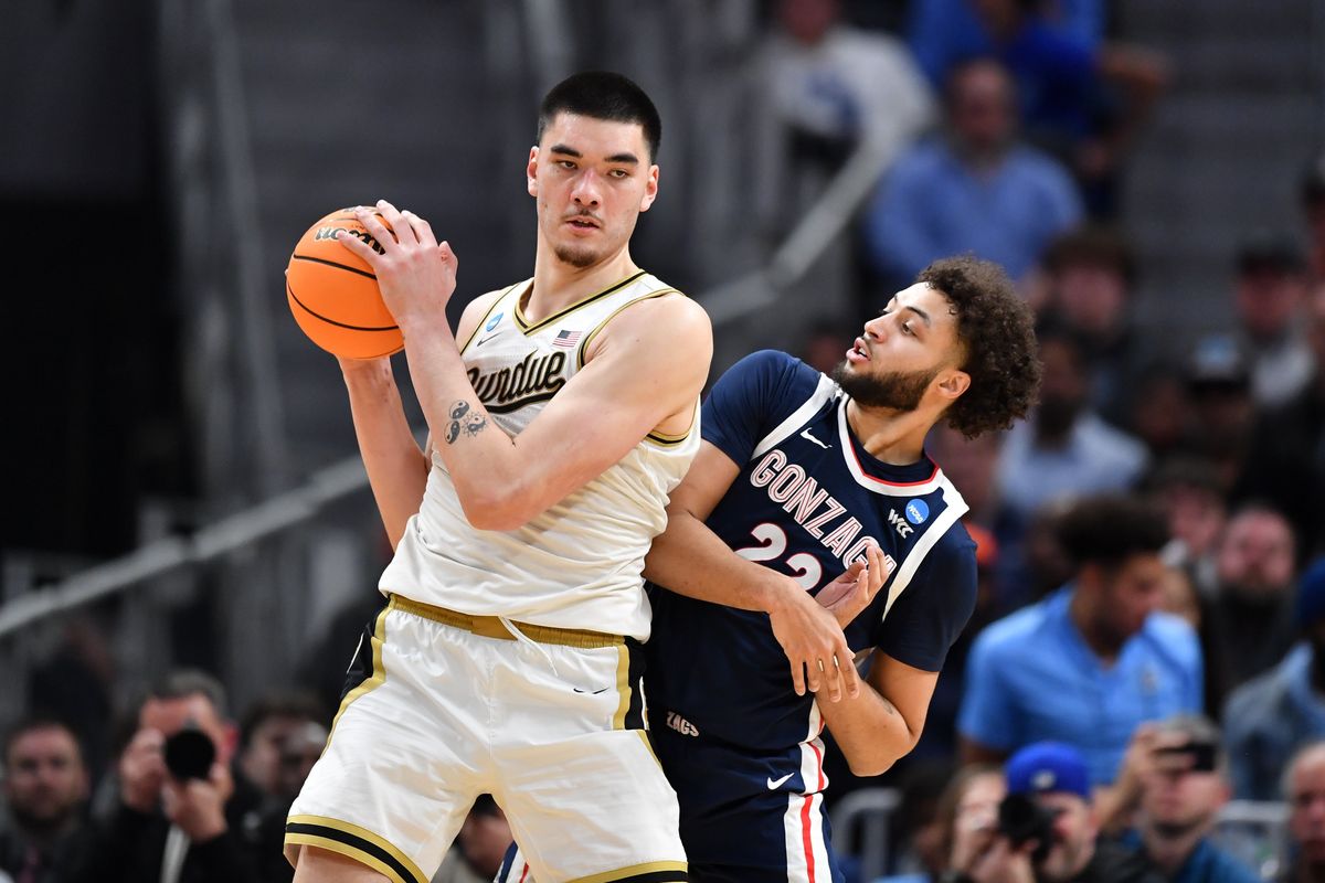 Gonzaga’s Anton Watson reacts as Purdue’s Zach Edey makes a move during the second half of Friday’s NCAA Tournament Sweet 16 game at Little Caesars Arena in Detroit.  (Tyler Tjomsland/The Spokesman-Review)