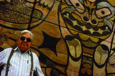 
George Horse Capture, a senior curator at the National Museum of the American Indian, stands before a painting of the God of Thunder made by the Nootka people of Vancouver Island. George Horse Capture, a senior curator at the National Museum of the American Indian, stands before a painting of the God of Thunder made by the Nootka people of Vancouver Island. 
 (Katherine Frey/Washington Post / The Spokesman-Review)