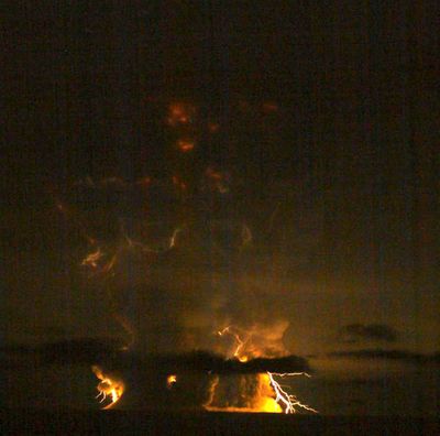 Photo Credit: Bretwood Higman / groundtruthtrekking.org via AVO
Mount Redoubt in Alaska blows its top again late last night, creating a fierce lightning storm.  (The Spokesman-Review)