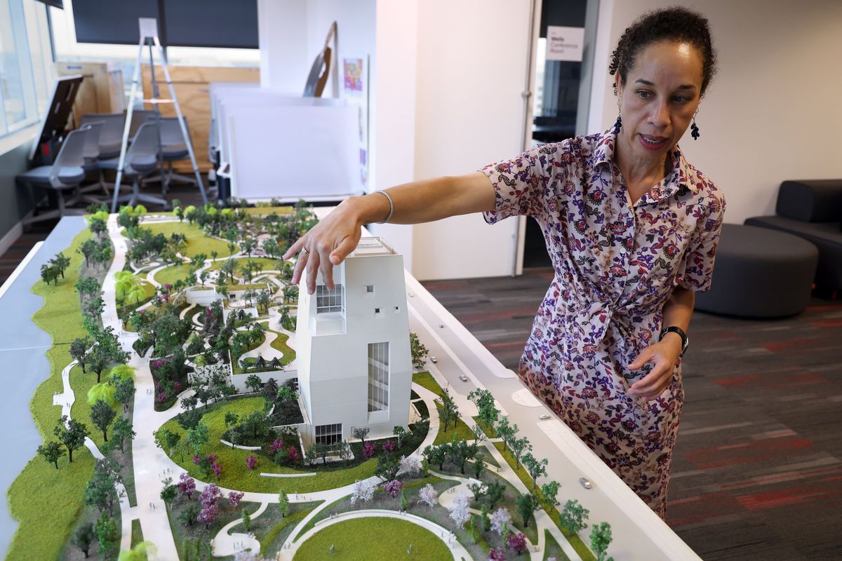 Louise Bernard, director of the Obama Presidential Center museum, with a mock-up of the presidential center at the Barack Obama Foundation’s headquarters.  (Terrence Antonio James/Chicago Tribune/TNS)