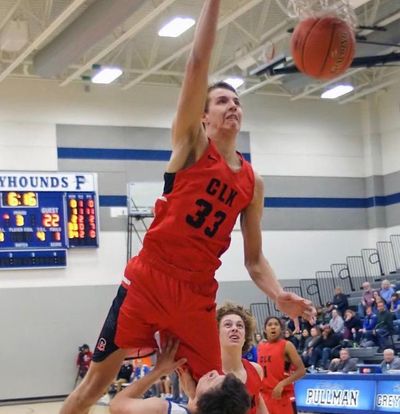 Clarkston High’s Brandton Chatfield dunks over a defender during a Great Northern League game against Pullman earlier this season. Chatfield has agreed to joined Washington State as a preferred walk-on. (Justin Jones/Courtesy)