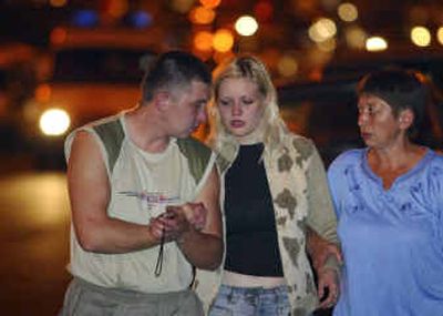
An unidentified woman is consoled near the site of an explosion outside the Rizhskaya subway station in Moscow on Tuesday. 
 (Associated Press / The Spokesman-Review)