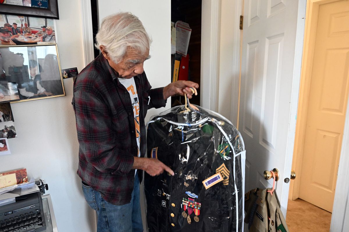 Jerry Garcia, originally from Richmond, Calif., shows his dress uniform, which he still can fit into, at his home on Aug. 30 in Spokane. He is now a widower living with family after serving 44 years in the U.S. Army, retiring in 1994. He admits now that he enlisted at 16, giving his correct birth year (1934), but was never called on it.  (Jesse Tinsley/The Spokesman-Review)