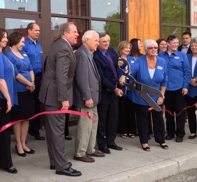 AAA Washington President and CEO, Kirk Nelson, board member, Greg Bever, and others formally open the new AAA travel store in Spokane
 (Cheryl-Anne Millsap / photo by Cheryl-Anne Millsap)