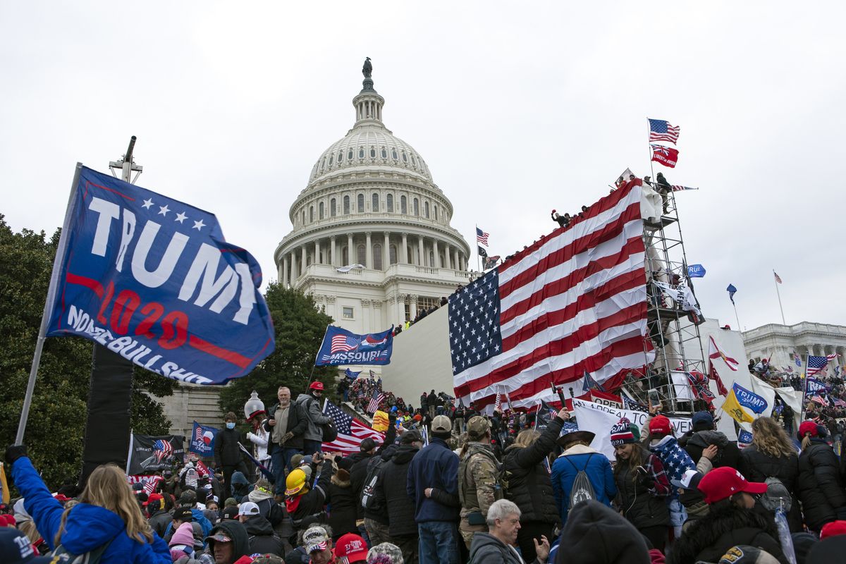 Rioters loyal to then-President Donald Trump outside of U.S. Capitol on Jan. 6, 2021, in Washington. Even as the first of the more than 500 federal Capitol riot defendants have begun to plead guilty, scores of suspects remain unidentified, reflecting the massive scale of the Justice Department