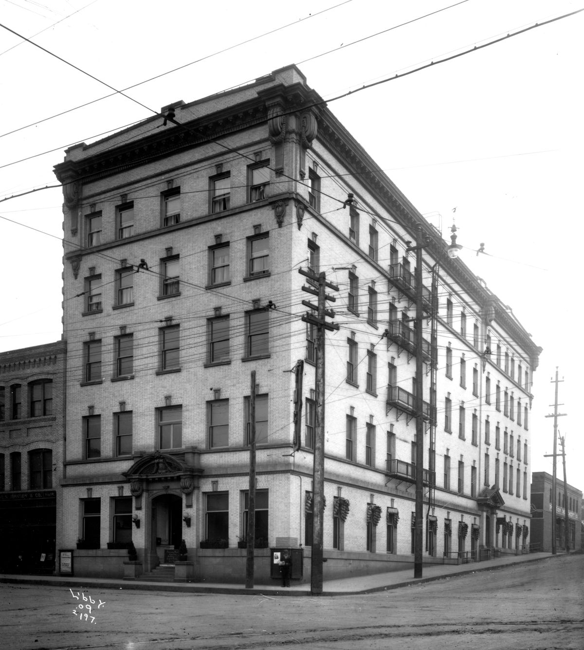 1909: The 1906 YMCA building at the corner of Lincoln Street and First Avenue. The interior held a gymnasium, running track, swimming pool, meeting rooms, apartments for rent and a restaurant. The building was retired and demolished in 1964, replaced with a building on Havermale Island. A motor hotel was built at this location shortly after. Over the years, the Y’s focus has gone from single young men to families and children, always with an emphasis on sports and fitness activities. (Libby Collection/Eastern Washington State Historical Society Archives)