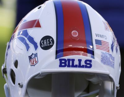 FILE - This Dec. 30, 2012, file photo shows a Buffalo Bills helmet displaying a WWFD (West Webster Fire Department) decal in memory of two fallen West Webster, N.Y., firefighters who lost their lives in a shooting and a S.H.E.S. decal in honor of the victims of the Sandy Hook Elementary School shootings, before an NFL football game against the New York Jets in Orchard Park, N.Y. The NFL is planning to allow players to have decals on the back of their helmets bearing names or initials of victims of systemic racism and police violence. The league has been in talks with individual players and their union since June about somehow honoring such victims.  (Associated Press)