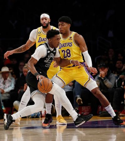 Los Angeles Lakers forward Rui Hachimura stands his ground defensively against San Antonio's Stanley Johnson. (Tribune News Service)