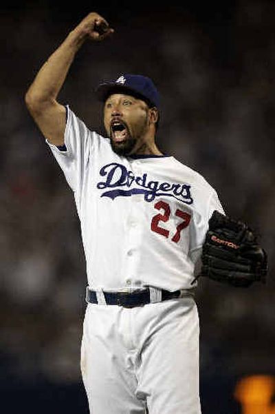 
Los Angeles starting pitcher Jose Lima exults after recording the final out of the eighth inning Saturday.
 (Associated Press / The Spokesman-Review)