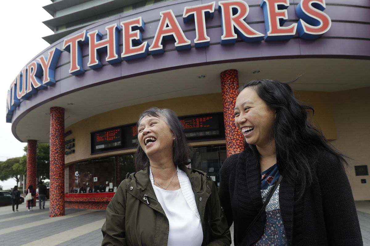 Alice Sue, left, and her daughter Audrey Sue-Matsumoto laugh while interviewed after watching the movie Crazy Rich Asians on Thursday, Aug. 23, 2018, in Daly City, Calif. It was Sue’s second time watching the movie. When “Crazy Rich Asians” surpassed expectations and grabbed the top spot in its opening weekend, the film also pulled off another surprising feat. It put Asians of a certain age in theater seats. (Jeff Chiu / AP)