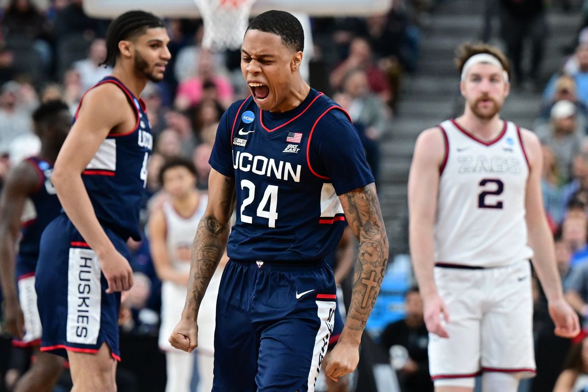 Connecticut Huskies guard Jordan Hawkins (24) celebrates after hitting a three over Gonzaga during the second half of an NCAA Tournament Elite 8 basketball game on Saturday, March 25, 2023, at T-Mobile Arena in Las Vegas, Nev. UConn won the game 82-54.  (Tyler Tjomsland/The Spokesman-Review)