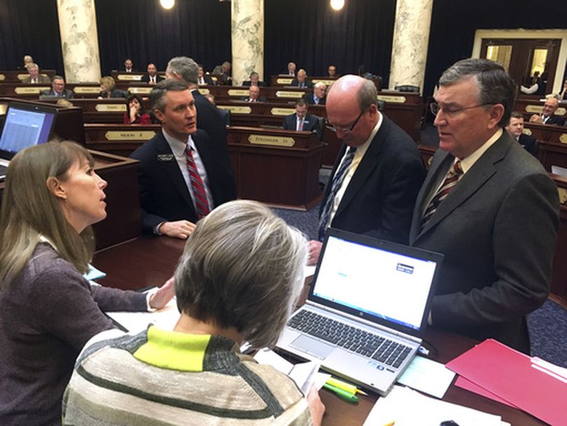 House GOP leaders confer with House clerks during Wednesday's extended debate over an unsuccessful move to call a bill out of committee, over the objections of the committee's chairman. (AP / Kimberlee Kruesi)