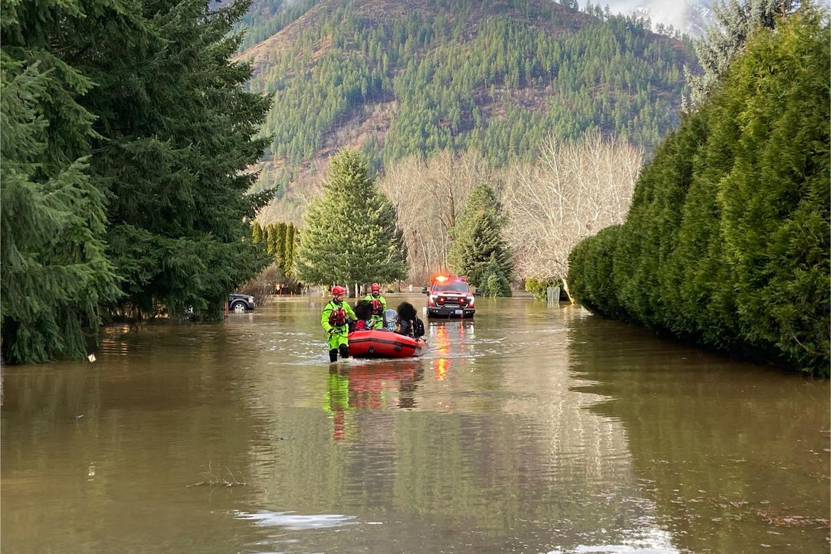 Chelan County Fire District 3 reported that Wenatchee Valley Fire Department deployed swiftwater technicians with a boat, which helped transport 12 people who were trapped in their homes after being cut off by floodwaters. (Chelan County Fire District 3/Facebook)