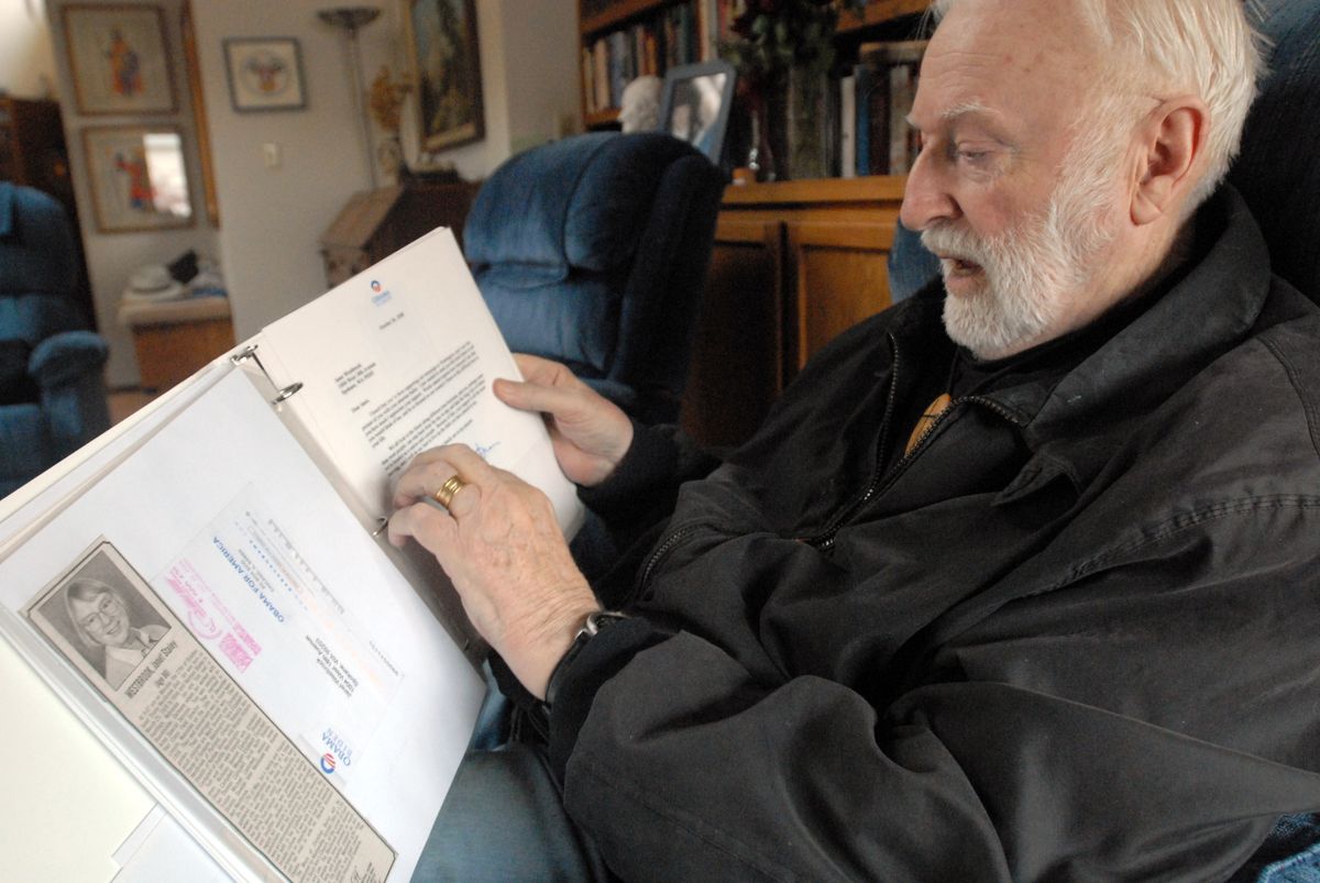 Tom Westbrook reads a short letter, addressed to his wife, Janet, received from Barack Obama a few days after she died.  (Jesse Tinsley / The Spokesman-Review)