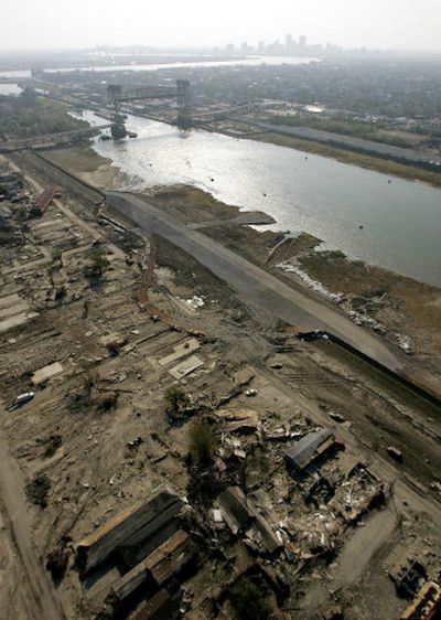 
Repairs continue on a large section where the levee broke during Hurricane Katrina in the lower Ninth Ward in New Orleans on Friday. 
 (Associated Press / The Spokesman-Review)