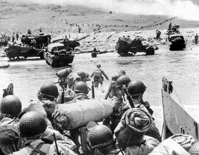 American soldiers land on the French coast of Normandy during the D-Day invasion in June 1944. (Associated Press)