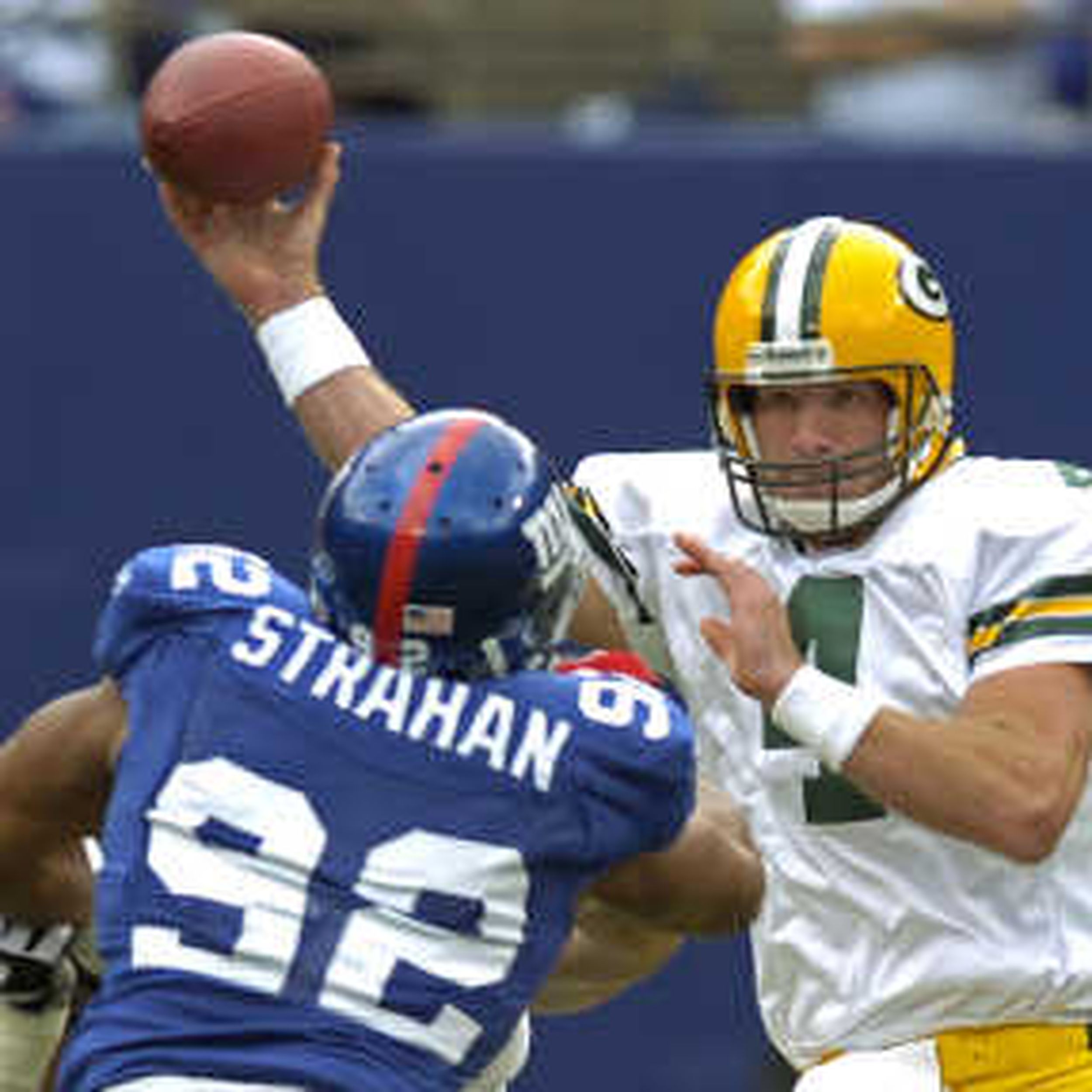 New York Giants Michael Strahan reacts to a sack in week 13 at